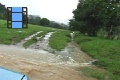 Scene_26_Crossing a flooded stream in a car